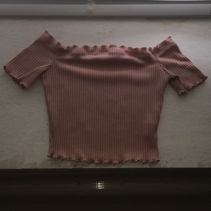 A crop top off the shoulder